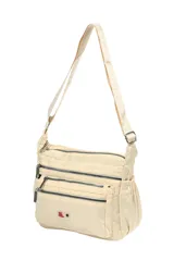 Bandolera de nylon color beige con múltiples compartimentos frontales con cierre, bolsillos laterales elásticos y correa ajustable.