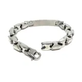 Pulsera de acero plateado de eslabones gruesos con detalle central rígido con circonia.