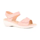Sandalias grises con plataforma blanca y ajuste con velcro.