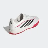Championes de fútbol Adidas modelo Copa Pure IV League Turf, diseñados para césped artificial. Presentan un diseño en color blanco perlado con las icónicas tres tiras en negro y detalles en rojo vibrante en la suela y laterales. Incorporan tecnología Fusionfeel en la parte superior para un mejor control del balón y una suela de goma con tapones diseñados para tracción en superficies sintéticas.