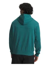 Buzo con capucha Under Armour Rival LW, color verde petróleo, confeccionado en tejido French Terry ligero. Presenta diseño de hombros caídos, bolsillos laterales abiertos, puños y bajo acanalados, y logotipo bordado en el pecho.