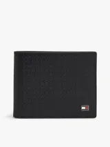Billetera compacta Tommy Hilfiger de cuero vacuno negro con textura grabada en relieve. Cuenta con el logo distintivo de la marca aplicado en la esquina inferior derecha.