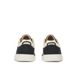 Championes Merrell modelo Cygnet Canvas para hombre, de lona negra con una gran "M" blanca en el lateral, suela de goma blanca y cordones blancos.