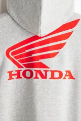 Campera con capucha gris melange de felpa con interior cepillado, cierre frontal, hombros caídos y bolsillos tipo canguro. Presenta estampado pequeño de Honda en el pecho.