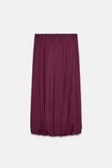 Falda midi de tiro alto con cintura elástica, diseño de pliegues verticales y bajo abullonado con elástico interior.