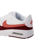 Championes Nike Air Max SC con diseño deportivo, cuerpo blanco con superposiciones de gamuza en color bordó y logo lateral en tono rosado. Cuenta con unidad de aire visible en la entresuela.