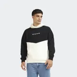 Canguro oversize de felpa con diseño combinado en bloques de color negro y blanco, capucha ajustable, bolsillo tipo canguro y pequeño estampado frontal.