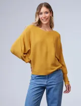 Buzo amarillo de tejido acanalado, manga larga y modelo dolman. Espalda con aplique de botones.