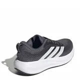 Championes de running Adidas Response Pace W para mujer, color gris oscuro con las icónicas tres tiras de la marca en un tono plateado brillante sobre los laterales y suela amortiguada en color blanco.