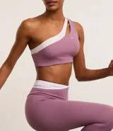 Calza deportiva color lila con cintura alta en V bicolor, confeccionada en microfibra ligera.