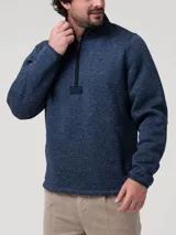 Polar de tejido jaspeado azul marino con cuello alto y cierre frontal parcial con tirador de cuero. Presenta bolsillos laterales con cierre.