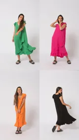 Vestido largo de simil lino con volados en el ruedo y mangas cortas con volados.