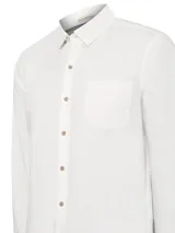 Camisa de manga larga color blanco, modelo Galiton de RKF, confeccionada en popelina de algodón orgánico. Cuenta con cuello camisero, cierre frontal con botones de madera, un bolsillo en el pecho con logo bordado y mangas ajustables.