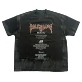 Remera de algodón heavyweight con corte oversize, color negro con efecto lavado y estampado gráfico frontal con tipografía estilo metal y texto motivacional.