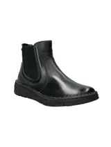 Botín tipo Chelsea de cuero negro con paneles elásticos laterales y suela de goma flexible con costura vista.
