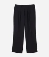 Pantalón de corte wide leg con diseño de sastrería, confeccionado en tejido estructurado con frisos frontales, bolsillos laterales y cierre invisible.