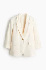 Blazer de botonadura sencilla en mezcla de lino y viscosa con solapas de muesca y cierre de un botón. Modelo con hombreras, pinzas moldeadoras adelante, abertura en los puños y bolsillos ribeteados con solapa, con abertura atrás y forrado.