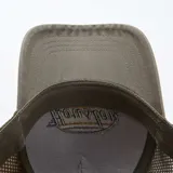 Gorra de gabardina color gris con paneles de malla verde en la parte trasera. Tiene bordado frontal con la palabra 'Houston' en azul y naranja sobre un óvalo blanco con borde marrón.