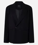 Blazer negro de mujer, modelo largo, con solapas y cierre cruzado de doble botonadura.