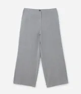 Pantalón de sastre con estampado de cuadros, corte wide leg de cintura alta y caída recta. Cuenta con cierre frontal de botón y cremallera.