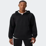 Canguro negro de tejido ComfortKnit con textura tipo waffle, capucha estructurada, media cremallera frontal y bolsillo tipo canguro con compartimento integrado para el móvil.
