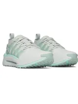Championes Under Armour modelo Phantom X, de diseño futurista en color blanco con detalles en verde agua. Presentan una parte superior de tejido transpirable, estructura de TPU en el mediopié para soporte y entresuela con amortiguación de espuma reactiva.