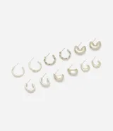 Kit de seis pares de aros argolla plateados con diferentes texturas y diseños, incluyendo modelos lisos, retorcidos, abombados y en forma de gota.