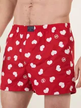 Bóxer de algodón blanco con estampado de flores pequeñas color celeste, con cintura elástica y logo de la marca en el centro.