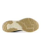 Championes New Balance Arishi V4, color azul con logo dorado, entresuela Fresh Foam y suela de goma.