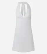 Vestido corto blanco de microfibra, con escote halter y espalda descubierta.