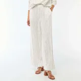 Pantalón palazzo de lino mezclado, color blanco con diseño de rayas verticales finas en color negro, de corte ancho y tiro alto con cintura elástica.