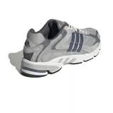 Championes adidas Response CL de estilo retro, confeccionados en una combinación de malla y gamuza en tonos grises. Presentan las icónicas tres tiras laterales en color gris oscuro, entresuela con tecnología adiPRENE para mayor amortiguación y suela de goma resistente.