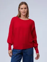 Buzo marca Cupio de tejido acanalado color azul. Tiene mangas largas estilo dolman y aplique de botones en la espalda.