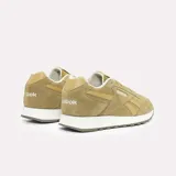 Championes urbanos Reebok modelo Glide, color marrón, confeccionados en gamuza con detalles en cuero sintético al tono. Presentan entresuela blanca y suela de goma dentada.