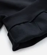 Hoodie negro de corte holgado con capucha y bolsillo frontal tipo canguro. Presenta una estampa fotográfica de Tupac Shakur en el pecho con el texto 'Tupac' y 'All Eyez On Me'.