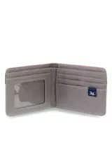 Billetera de lona color beige con detalle en cuero marrón y logo "Legacy" en la esquina inferior derecha.