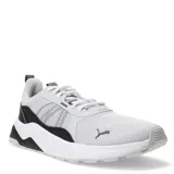 Championes Puma Anzarun 2.0 de diseño deportivo, confeccionados en malla textil transpirable con refuerzos sintéticos. Presentan una entresuela gruesa de IMEVA para mayor amortiguación y suela de goma con relieve. Incluyen el logo de la marca en el lateral.
