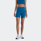 Calza corta deportiva New Balance modelo Harmony High Rise, de talle alto y ajuste ceñido al cuerpo, en color azul con logo reflectante de la marca en la pierna izquierda.