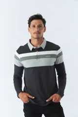 Remera polo de manga larga con diseño a rayas horizontales en tonos negro, gris y blanco. Logo de la marca Mistral bordado en el pecho.
