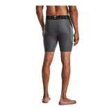 Calza deportiva corta Under Armour modelo HeatGear Compression, color negro con cintura elástica ancha gris y logo de la marca estampado en blanco en la pierna derecha.