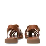 Sandalias franciscanas de cuero color marrón, con diseño de tiras cruzadas, punta cerrada y suela plana. Cuentan con cierre de hebilla metálica ajustable en el tobillo y detalle de aplique metálico con el logo de la marca.