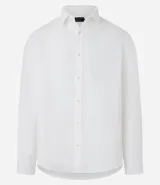 Camisa blanca de lino con cuello con solapa, abotonadura frontal y manga larga. Presenta un corte comfort, ligeramente más holgado.