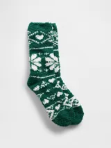 Medias de textura suave y afelpada, color verde con estampado de copos de nieve en blanco.