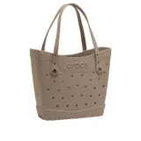 Bolso tipo tote Crocs Classic Medium, color negro, fabricado con material sintético con múltiples perforaciones para personalizar con Jibbitz, asas dobles y base texturizada antideslizante.