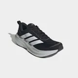 Championes de running Adidas Supernova Glide, color negro con las tres tiras clásicas en blanco y suela con amortiguación gruesa.