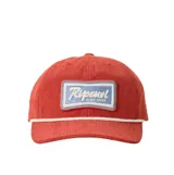 Gorra de pana color rojo, con cordón decorativo blanco en la base de la visera y parche bordado frontal con el logo de Rip Curl Surf Shop.