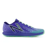 Championes de tenis New Balance modelo 996, color violeta con detalles en verde.