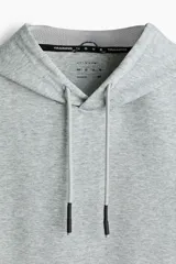 Buzo deportivo sin mangas color gris melange, con capucha ajustable mediante cordones y corte regular.