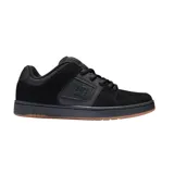Championes de skate DC modelo Manteca 4, color negro con suela de goma color caramelo. Diseño robusto con paneles de gamuza y cuero sintético, logo de la marca en el lateral y lengüeta acolchada.