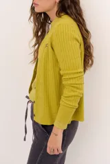 Cardigan tejido de punto con diseño de ochos, color celeste, de manga larga.